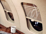 Mechanical window shades for a Falcon 20 interior